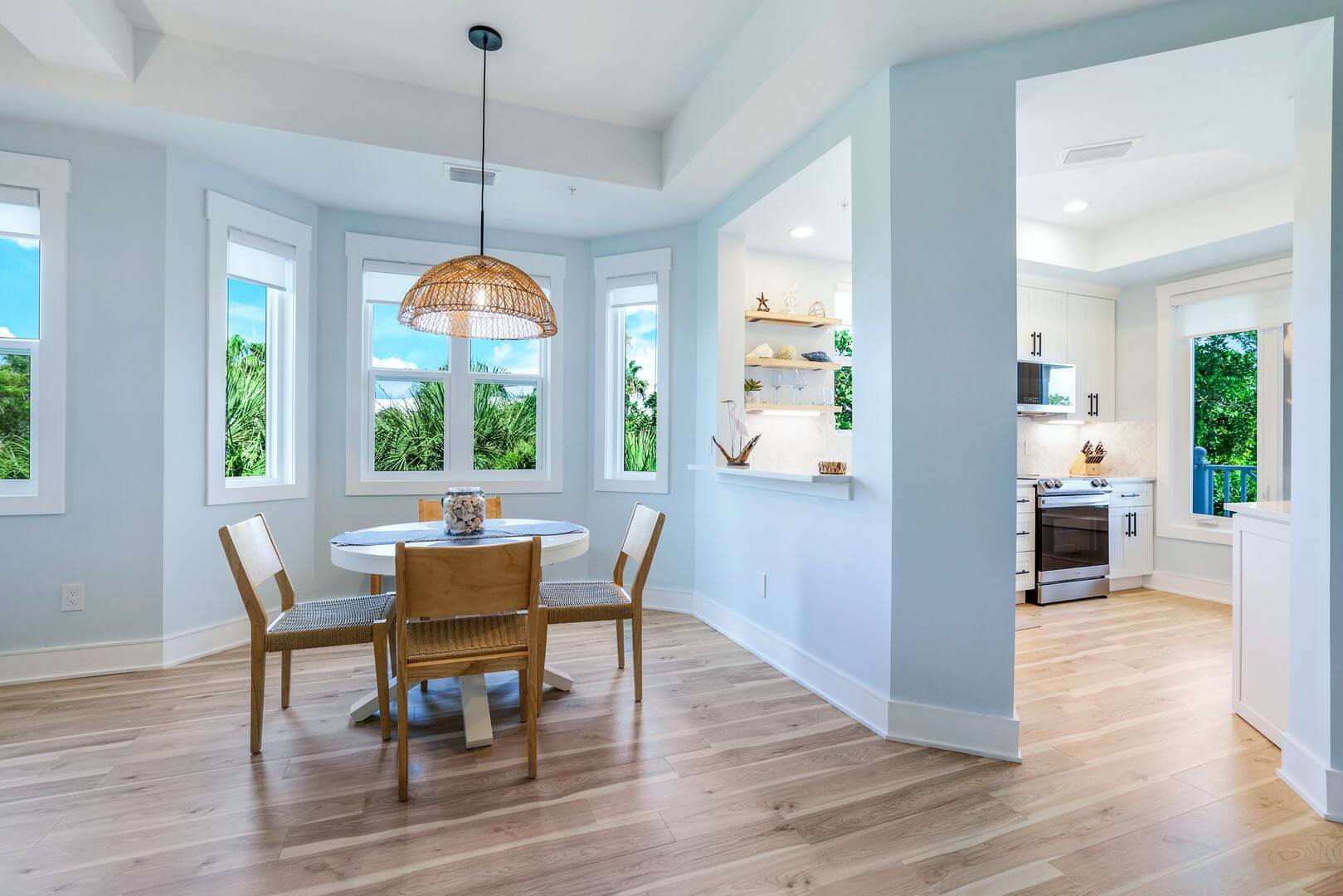 Bright dining area with wooden furniture.