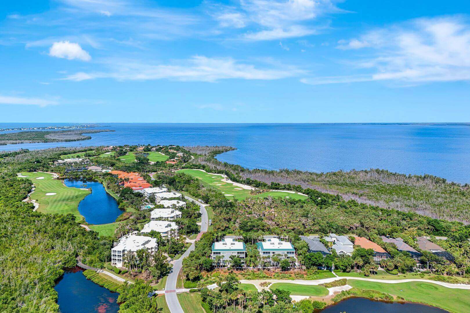 Aerial view of coastal golf course landscape.