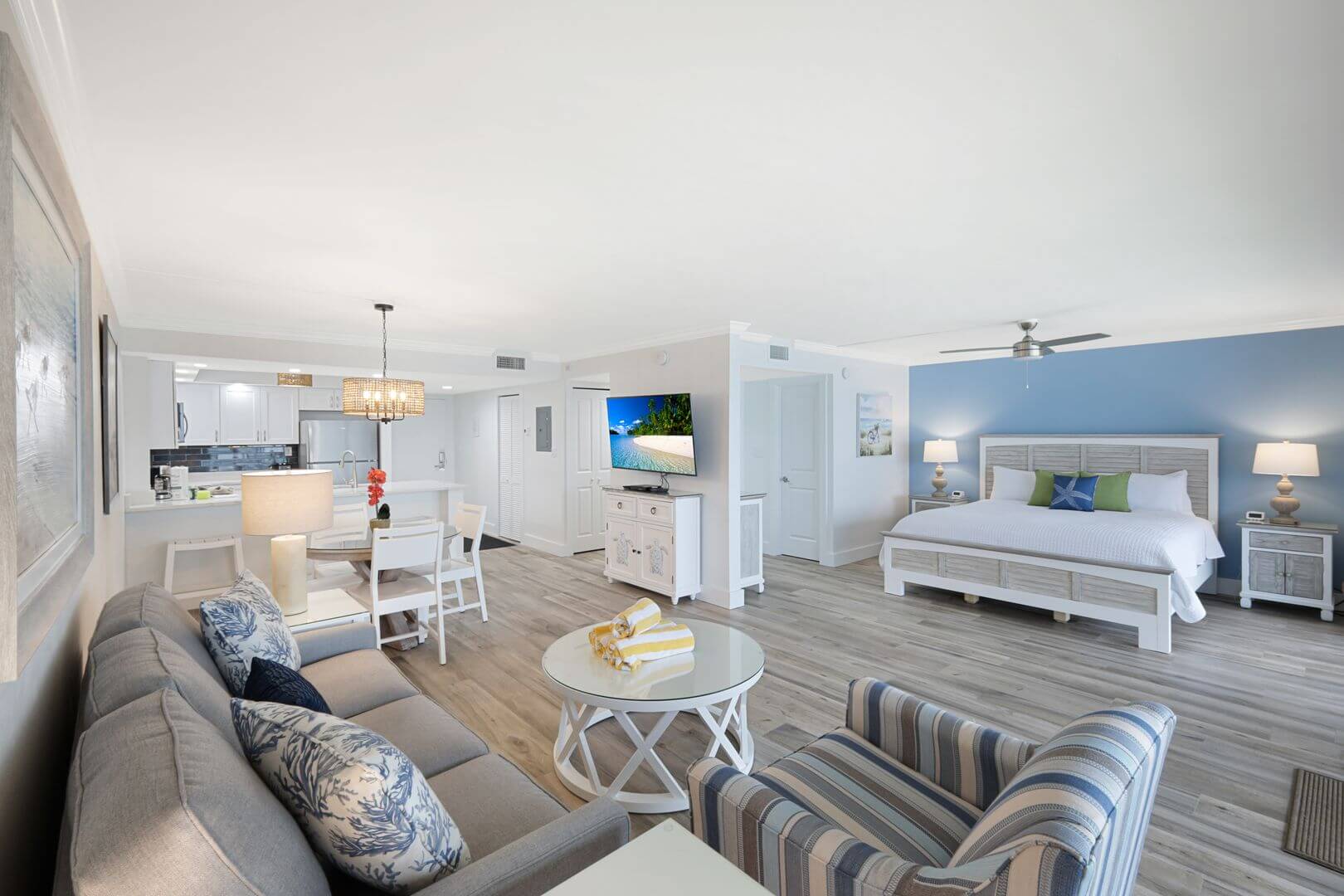 Modern open-plan living room and bedroom suite.