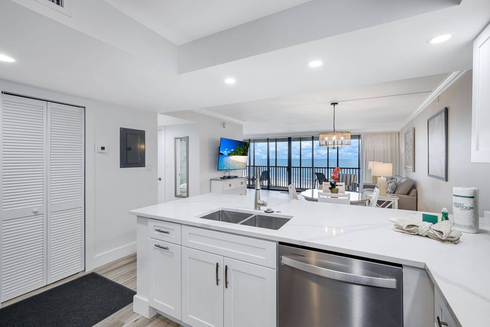 Modern kitchen and living room with view.