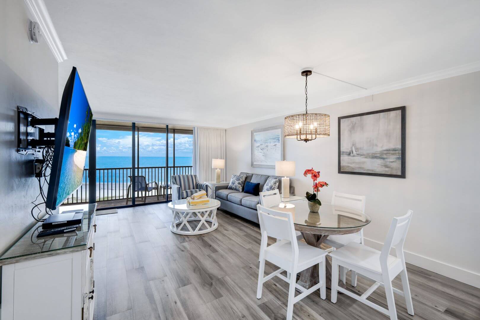 Modern living room with ocean view balcony.