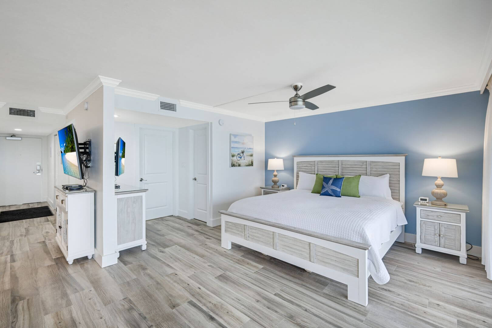 Modern bedroom with blue accent wall.