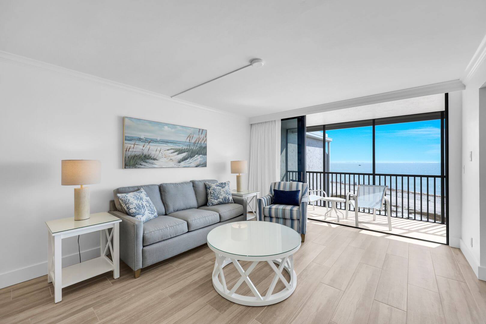 Modern living room with ocean view balcony.