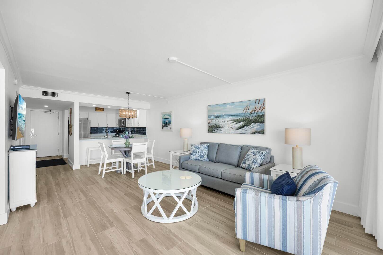 Modern coastal living room with blue accents.