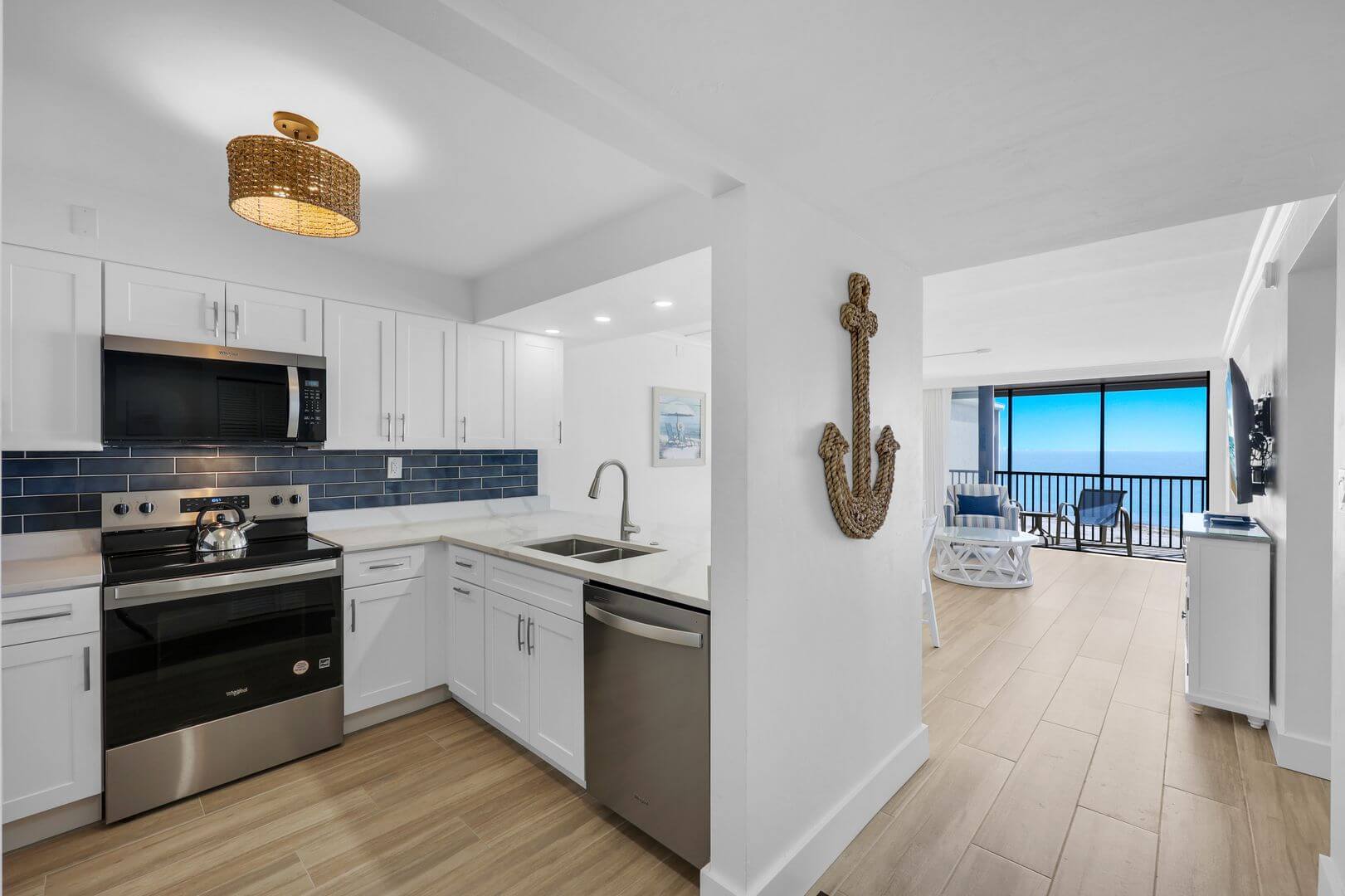 Modern kitchen with ocean view and decor.