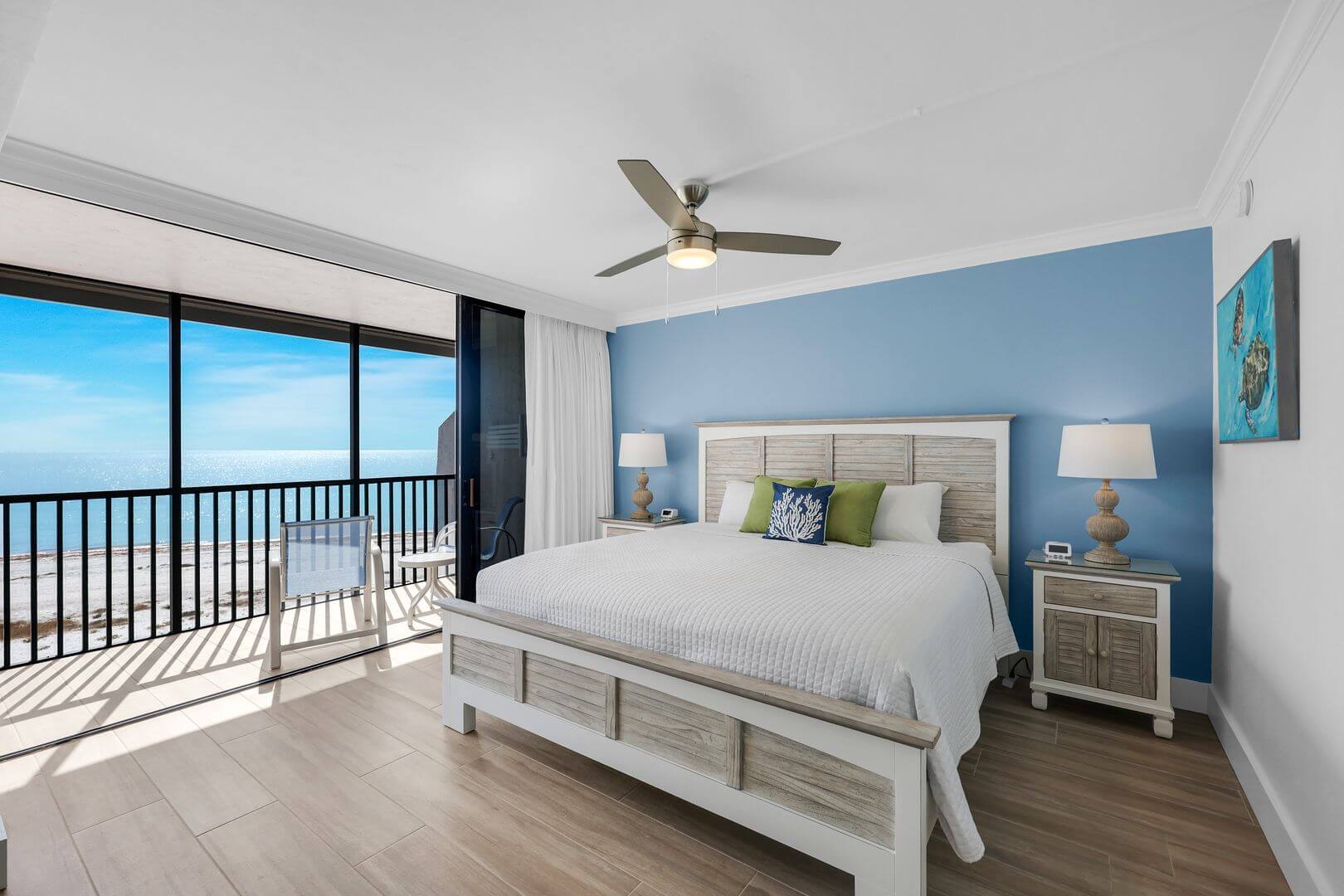 Modern bedroom with ocean view balcony.