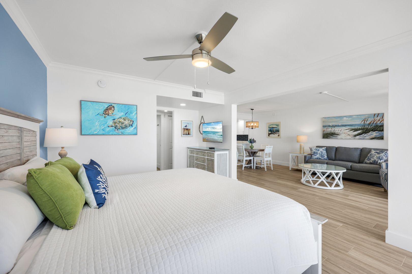Spacious bedroom with modern coastal decor.